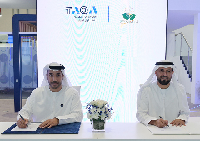 Taqa Water Solutions and Royal Gardens Agricultural Contracting officials sign the deal.